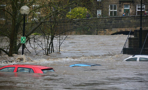 Cars submerged in flood waters.