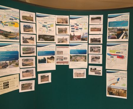 Information board displaying flood alleviation scheme details.
