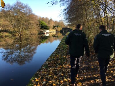 Environment Agency staff walking along the canal path.