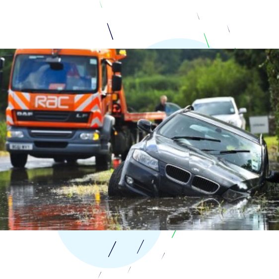 Breakdown company rescuing a car submerged in flood water.
