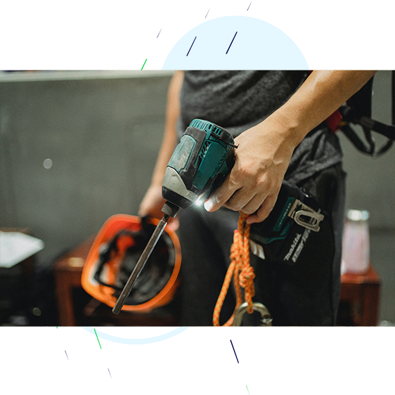 Tradesman using a drill.