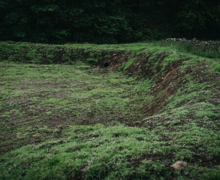 Looking sideways into a attenuation pond.