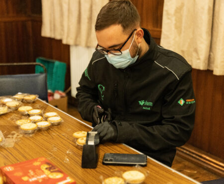 Assistant Engineer, Joe, wrapping mince pies, for Calder Community Cares “It’s a Wrap” Campaign for Christmas 2021