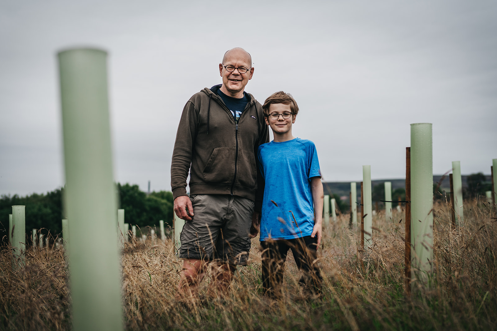 Father and son plant trees together