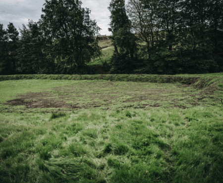 Empty attenuation basin in Calderdale, funded by the NFM grant scheme.