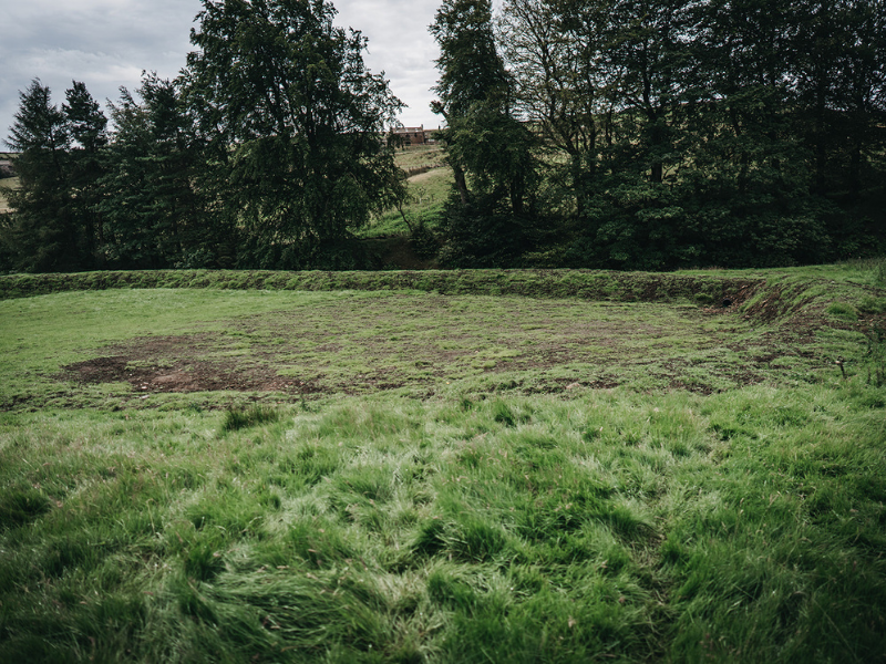 Empty attenuation basin in Calderdale, funded by the NFM grant scheme.
