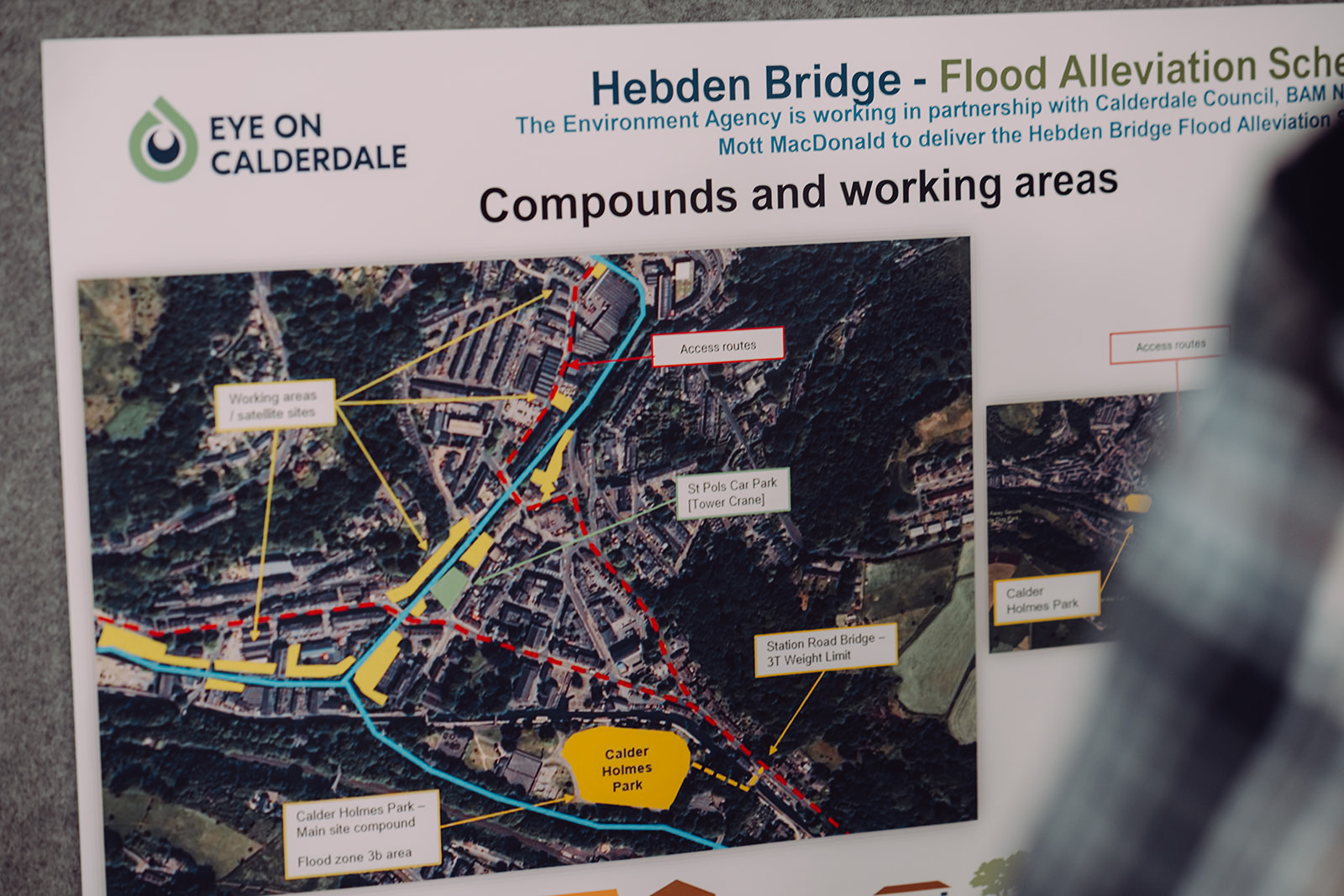 Hebden Bridge Flood Alleviation Scheme information board displaying a detailed map. The map outlines the local area, highlighting key flood risk zones, river paths, and planned or existing flood defences. Labels and colour-coded sections provide clear visual guidance for residents and visitors about the scheme’s scope and impact.