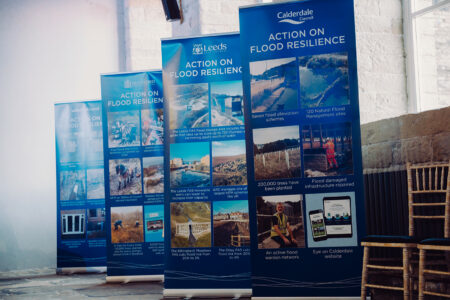 Banner stands ar West Yorkshire Flood Summit that highlight key achievements for local authorities