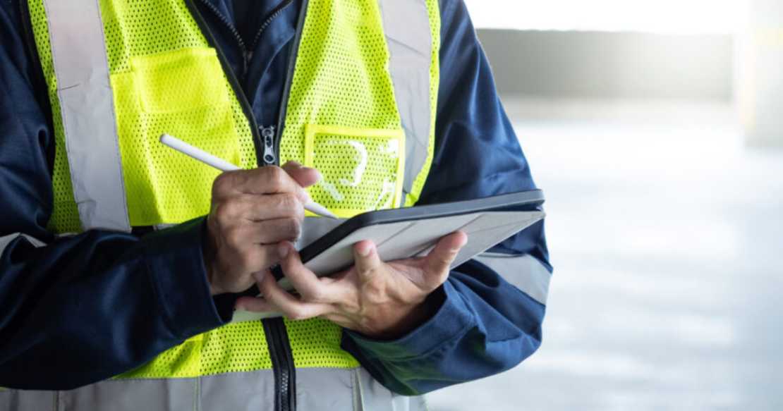 Person with high vis jacket and clip board